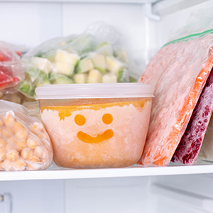 Leftovers in baggies and storage containers in a freezer