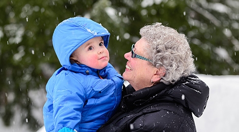 Older woman holding infant