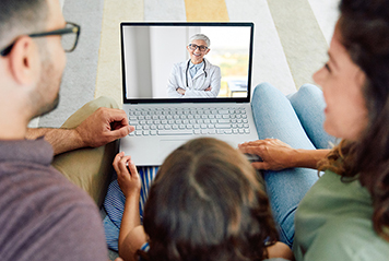Family on video call with healthcare provider