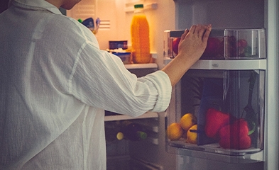 Person looking in refrigerator
