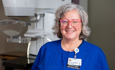 Mammography specialist in front of mammography machine