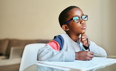 Child writing in journal