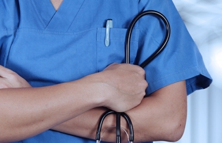 Photo of healthcare provider holding stethoscope