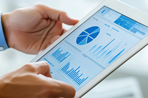 Man holding tablet displaying health data