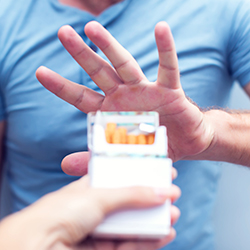 Man refusing offering of cigarettes