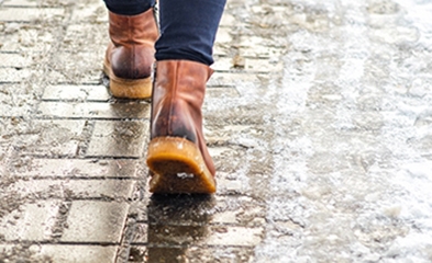 Photo of boots on snowy walkway