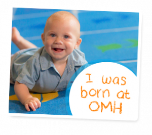 Baby with text reading "I was born at OMH"