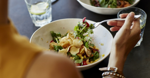 Person eating salad