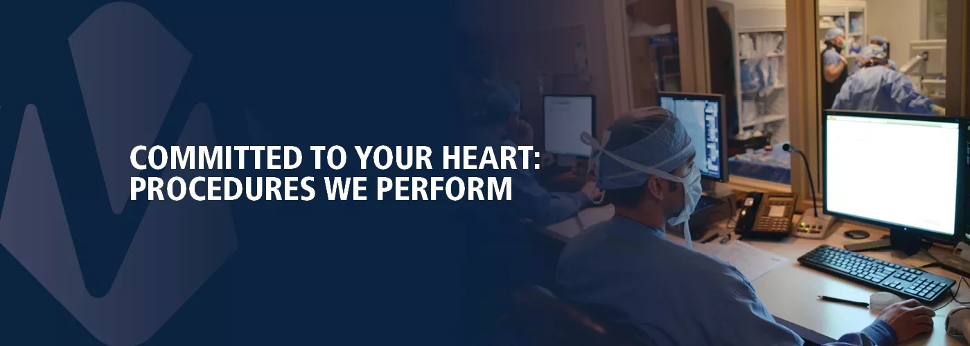 Healthcare provider reading test results at a computer screen