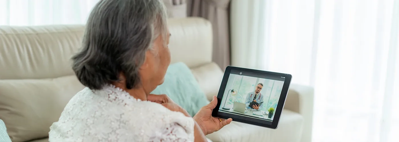 Woman in video call with healthcare provider