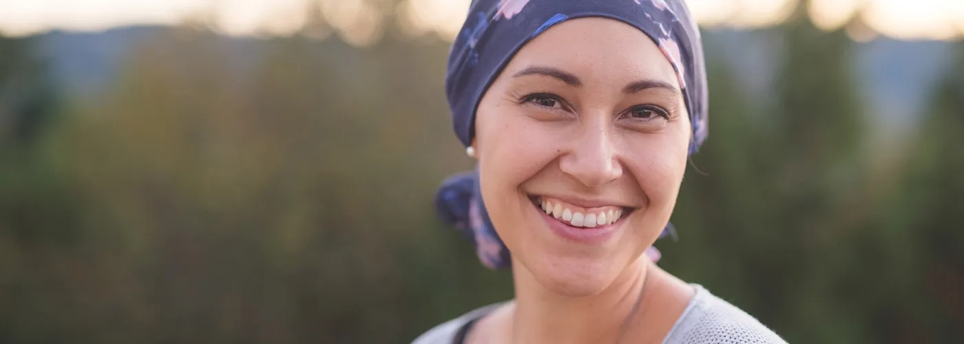 Woman outdoors, wearing bandana