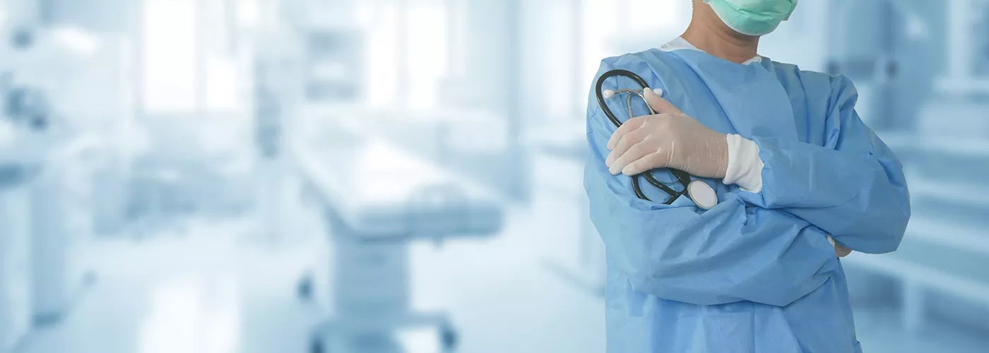 Surgeon in scrubs in operating theater